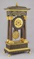 Brass casted french portico mantel clock in gothic style.