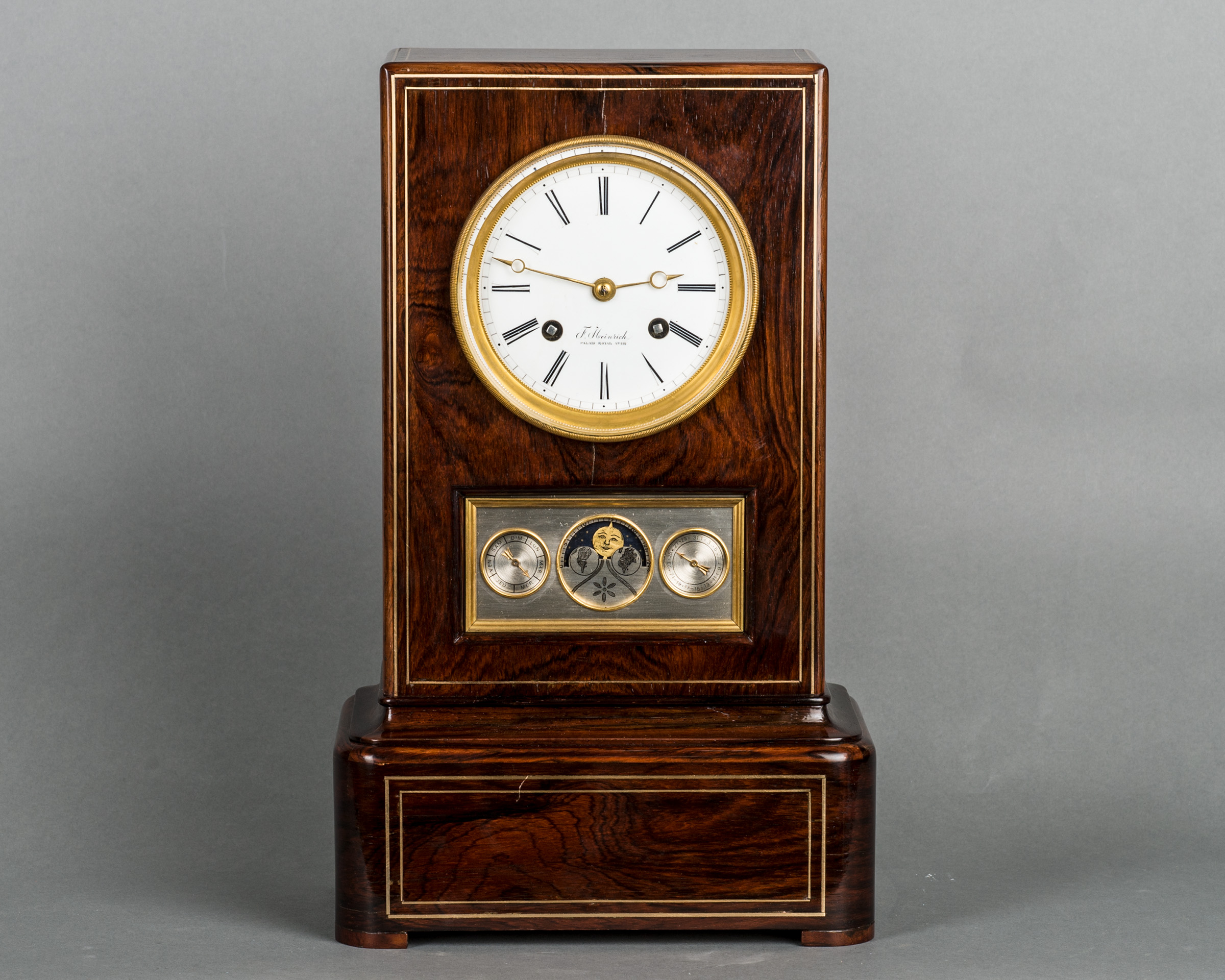 The unusual kingwood mantel clock with calendar work and moon fase, circa 1840