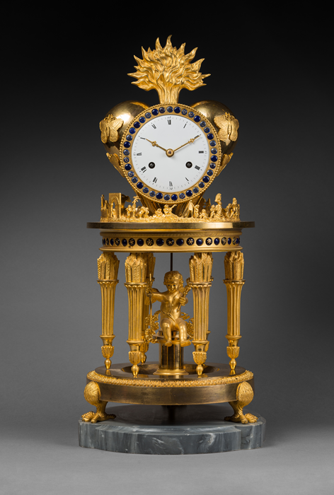 Case Attributed to Jean-Simon Deverberie (1764 - 1824)
Rare Chased and Gilt Bronze Mantel Clock 
“The Temple of Love”  
Paris, Directoire period, circa 1795 
Height 51 cm; diameter 23 cm