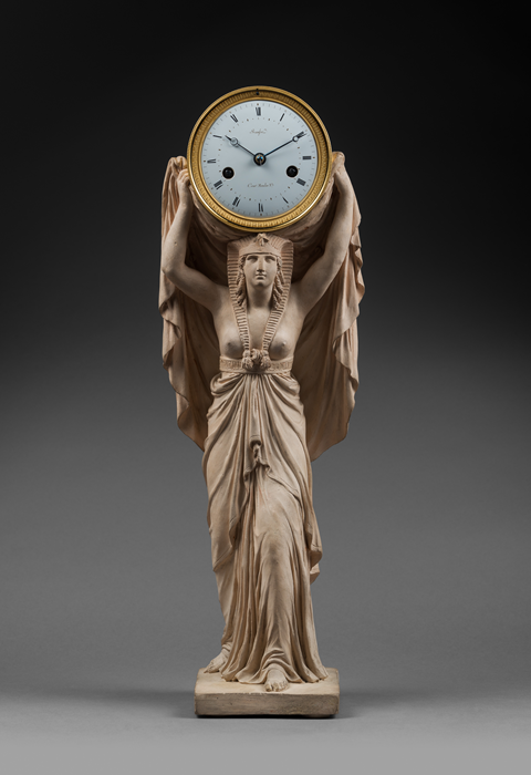 Louis Bausse 
Terra Cotta Figure after a Model by Louis-Simon Boizot (1743-1809)
Rare “Egyptian Caryatid” Terra Cotta Mantel Clock  
Paris, early Empire period, circa 1805 
 