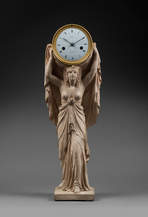 Louis Bausse 
Terra Cotta Figure after a Model by Louis-Simon Boizot (1743-1809)
Rare “Egyptian Caryatid” Terra Cotta Mantel Clock  
Paris, early Empire period, circa 1805 
 