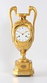 French ormolu urn clock. c. 1800.