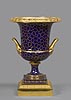 A superb Louis XVI Sèvres porcelain Medici vase à tête de Jupiter with a blue interlaced L mark with Empire gilt bronze mounts