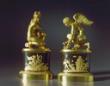 A very fine pair of Empire gilt and patinated bronze statuettes