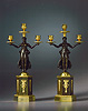 A fine pair of Empire patinated and gilt bronze candelabra