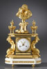 A rare and highly important late eighteenth century gilt bronze and white marble figural mantle clock of eight day duration, signed on the white enamel dial Bourret Paria