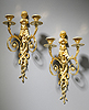 A superb pair of Louis XVI gilt bronze two-light wall-lights after a design by Jean Hauré