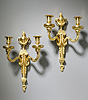 A very fine pair of Louis XVI gilt bronze two-light wall-lights attributed to Jean-Louis Prieur