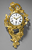 A superb Louis XV gilt bronze cartel clock of eight day duration, signed on the white enamel dial Gudin à Paris