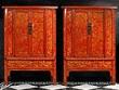A pair of Chinese red laquer cupboards