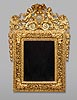 A rare and extremely fine quality Louis XIV carved giltwood mirror