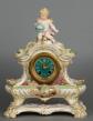 Striking K.P.M. signed porcelain mantel clock with matching base