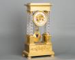 An attractive Charles X ormolu and crystal portico striking 8-day mantel clock