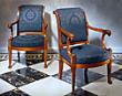 A pair of Empire lions head fauteuils