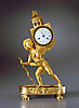 An extremely fine Empire gilt bronze clock