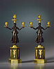 A fine pair of Empire patinated and gilt bronze candelabra