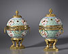 A very fine pair of Régence and Louis XVI gilt bronze mounted late Kangxi period porcelain pot-pourri vases