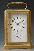 'One piece case’, gilt engraved carriage clock, striking and alarm, Jura ca 1840.