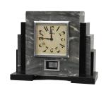 An early 20th century French marble Atmos mantel timepiece set Reutter, number 1528.