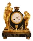 An early 19th century French patinated and gilt bronze figural mantel clock.