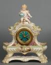 Striking K.P.M. signed porcelain mantel clock with matching base