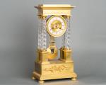 An attractive Charles X ormolu and crystal portico striking 8-day mantel clock