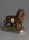 Small animated lion desk clock, circa 1880.