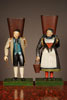 Two amusing polychrome painted tin figures of a wine farmer and his wife, mid 19th Century.