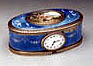A very beautiful oval silver and enamel singing bird box with clock signed Paul Leopold Buhré, Le Locle.