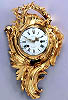 A superb Louis XVI gilt bronze cartel clock of eight day duration, signed on the white enamel dial Gudin à Paris.
