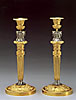 A superb pair of empire gilt and silvered bronze figural candlesticks