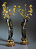 A fine and large pair of Louis XVI patinated and gilt bronze candelabra