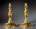 A wonderful pair of Louis XV style gilt bronze figural candlesticks