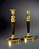 A fine pair of Empire patinated and gilt bronze candelsticks
