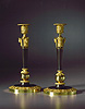 A fine pair of Russian bronze and gilt bronze candlesticks