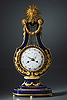 An important Louis XVI gilt bronze mounted Sèvres porcelain lyre clock by Kinable