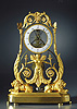 An extremely rare Empire glass plated skeleton clock