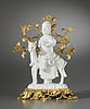A very fine K’ang Hsi Dehua Blanc de Chine figure of Guan-Di seated on his horse on a base of clouds