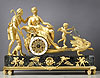 An extremely fine Empire gilt bronze and grey veined black marble chariot clock of eight day duration