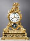 A very important Louis XV gilt bronze astronomical mantle clock of eight day duration, signed on the case below the white enamel dial Millot