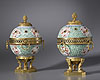 A very fine pair of Régence and Louis XVI gilt bronze mounted late Kangxi period porcelain pot-pourri vases