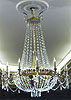 A very fine Empire gilt bronze and cut glass twelve-light chandelier