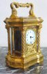 An small oval French carriage clock with Corinthian columns, circa 1880.