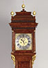 An elegant burr thuja 8-day long-case clock.