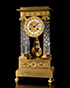 A small French Empire gilt bronze and crystal portico mantel clock, ca. 1810, height 37½cms