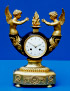 An outstanding Empire gilt bronze figural clock of eight day duration.